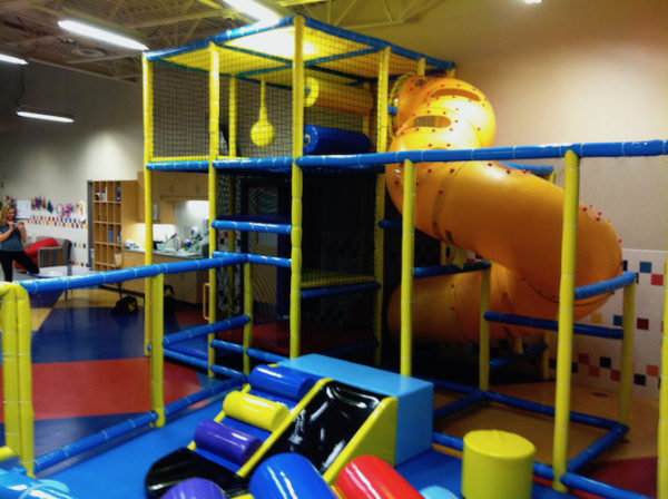 toddler area with small playground includes corkscrew slide and toddler slide components
