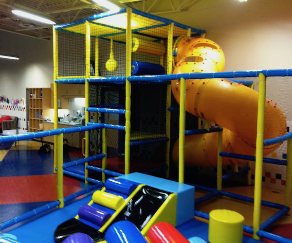 toddler area with small playground includes corkscrew slide and toddler slide components